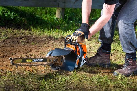 digging a trench with a mini digger|small powerful handheld trenchers.